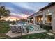 Expansive backyard features a sparkling pool, spa, covered patio, and lush landscaping at 7327 E La Junta Rd, Scottsdale, AZ 85255