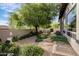 Landscaped backyard with desert plants and stone walkway at 7327 E La Junta Rd, Scottsdale, AZ 85255