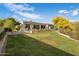 Sprawling lawn with patio, pool, and outdoor seating areas at 7327 E La Junta Rd, Scottsdale, AZ 85255