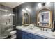 Stylish bathroom featuring a double vanity, white marble countertop, and decorative arched mirrors at 7327 E La Junta Rd, Scottsdale, AZ 85255