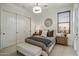 Comfortable bedroom with a cozy bed, neutral tones, and ample closet space at 7327 E La Junta Rd, Scottsdale, AZ 85255