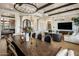 Open-concept dining and living room boasts a large dining table and cozy seating at 7327 E La Junta Rd, Scottsdale, AZ 85255