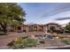 Stunning home featuring a circular driveway with water fountain and professional landscaping at 7327 E La Junta Rd, Scottsdale, AZ 85255