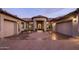 The attractive home boasts desert landscaping, a circular paver driveway, and multiple garages at 7327 E La Junta Rd, Scottsdale, AZ 85255
