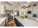 Modern kitchen with a large island, stainless steel appliances, and custom cabinets, perfect for cooking at 7327 E La Junta Rd, Scottsdale, AZ 85255