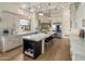 Bright and modern kitchen featuring an island with barstool seating and stainless steel appliances at 7327 E La Junta Rd, Scottsdale, AZ 85255