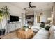 Bright living room with modern decor, a large TV, and comfortable seating at 7327 E La Junta Rd, Scottsdale, AZ 85255