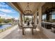 Covered patio with dining table and pool view; outdoor entertaining at 7327 E La Junta Rd, Scottsdale, AZ 85255