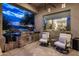 Outdoor kitchen features stainless steel appliances and a bar with seating, ideal for entertaining at 7327 E La Junta Rd, Scottsdale, AZ 85255