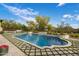 Beautiful pool and spa area with lush landscaping and seating at 7327 E La Junta Rd, Scottsdale, AZ 85255