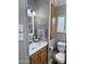 Cozy bathroom with a single sink vanity, modern fixtures, and tiled flooring at 7750 E Broadway Rd # 774, Mesa, AZ 85208