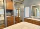 Bedroom showing built-in storage, mirrored closet doors, and blue accents at 7750 E Broadway Rd # 774, Mesa, AZ 85208