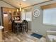 Cozy dining area with a stylish table set, adjacent to a built in china cabinet at 7750 E Broadway Rd # 774, Mesa, AZ 85208