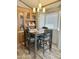 Charming dining area featuring a classic table set and built-in display cabinet, flooded with natural light at 7750 E Broadway Rd # 774, Mesa, AZ 85208