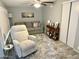 Cozy living room features a comfortable recliner, sofa, and ceiling fan at 7750 E Broadway Rd # 774, Mesa, AZ 85208