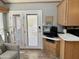 Bright living room features double doors, entertainment center, and cozy seating area at 7750 E Broadway Rd # 774, Mesa, AZ 85208