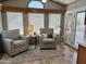 Cozy living room featuring comfortable seating, a bright window, and stylish decor at 7750 E Broadway Rd # 774, Mesa, AZ 85208