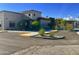 Well-maintained parking area with landscaping and visible parking spaces for residents and guests at 7750 E Broadway Rd # 774, Mesa, AZ 85208