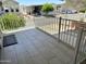 Inviting tiled patio with white railing, perfect for relaxing and enjoying the community views at 7750 E Broadway Rd # 774, Mesa, AZ 85208