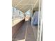 Brick-paved walkway with wrought-iron gate between carports at 7750 E Broadway Rd # 774, Mesa, AZ 85208