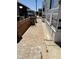 Side of home with brick and concrete walkway leading to the carport area at 7750 E Broadway Rd # 774, Mesa, AZ 85208