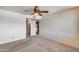 Inviting bedroom with carpet, neutral walls, ceiling fan, and natural light from the window at 8225 N Central Ave # 44, Phoenix, AZ 85020