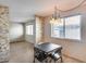 Inviting dining room featuring neutral colors, tile floors, and a contemporary chandelier at 8225 N Central Ave # 44, Phoenix, AZ 85020