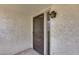 Exterior front door showing front porch, screen door and exterior wall texture at 8225 N Central Ave # 44, Phoenix, AZ 85020