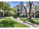 Charming home with a red tile roof, balcony and large shade tree in the front yard at 8225 N Central Ave # 44, Phoenix, AZ 85020