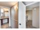 Hallway featuring open door into bathroom and a stairwell at 8225 N Central Ave # 44, Phoenix, AZ 85020
