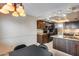 Updated Kitchen featuring granite counters, dark wood cabinets, and black appliances at 8225 N Central Ave # 44, Phoenix, AZ 85020