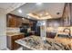 Updated kitchen with granite countertops, black appliances, recessed lighting, and ample cabinetry at 8225 N Central Ave # 44, Phoenix, AZ 85020
