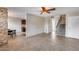 Open concept living room featuring neutral paint, tile floor, and stairwell at 8225 N Central Ave # 44, Phoenix, AZ 85020