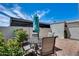 Private patio featuring a wrought iron outdoor dining set and a small garden area at 8225 N Central Ave # 44, Phoenix, AZ 85020
