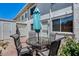 Private patio featuring a wrought iron outdoor dining set and a small garden area at 8225 N Central Ave # 44, Phoenix, AZ 85020