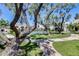 Community pool area surrounded by mature trees and grassy areas at 8225 N Central Ave # 44, Phoenix, AZ 85020