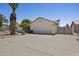 Front exterior of home with a two-car garage and desert landscaping at 843 E Vera Ln, Tempe, AZ 85284