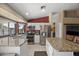 Modern kitchen with stainless steel appliances, granite counters, and ample cabinetry for storage at 843 E Vera Ln, Tempe, AZ 85284