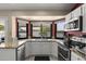 Bright kitchen with bay window, granite counters, stainless appliances and ample natural light at 843 E Vera Ln, Tempe, AZ 85284
