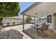 Covered patio with a view of the landscaped backyard and sparkling pool at 843 E Vera Ln, Tempe, AZ 85284