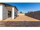 Expansive backyard featuring a covered patio and block wall at 8679 W Raven Dr, Arizona City, AZ 85123