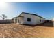 Backyard featuring the home's elevation and covered patio at 8679 W Raven Dr, Arizona City, AZ 85123