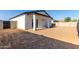 Spacious backyard with an open patio, block wall, and plenty of room for customization at 8679 W Raven Dr, Arizona City, AZ 85123