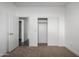 Bedroom with carpeted floor and both entry and closet doors at 8679 W Raven Dr, Arizona City, AZ 85123