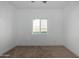 A bright bedroom featuring a window, carpeted floor, and a ceiling fan for comfort at 8679 W Raven Dr, Arizona City, AZ 85123