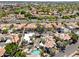 Aerial view of community featuring red tile roofs, mature trees, and a community pool at 8844 S 51St St # 3, Phoenix, AZ 85044