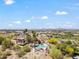 Aerial view of community pool area with mountain views and lush desert landscaping at 8844 S 51St St # 3, Phoenix, AZ 85044