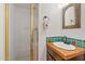 Bathroom featuring a shower, sink, tile countertop and backsplash at 8844 S 51St St # 3, Phoenix, AZ 85044