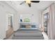 Bright bedroom featuring a ceiling fan, balcony, and an arched window providing natural light at 8844 S 51St St # 3, Phoenix, AZ 85044
