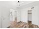 Bedroom with vaulted ceiling, wood-look floors, ceiling fan, and closet at 8844 S 51St St # 3, Phoenix, AZ 85044